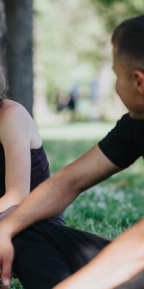 Two people sitting together in soft light, suggesting closeness and quiet reflection on connection